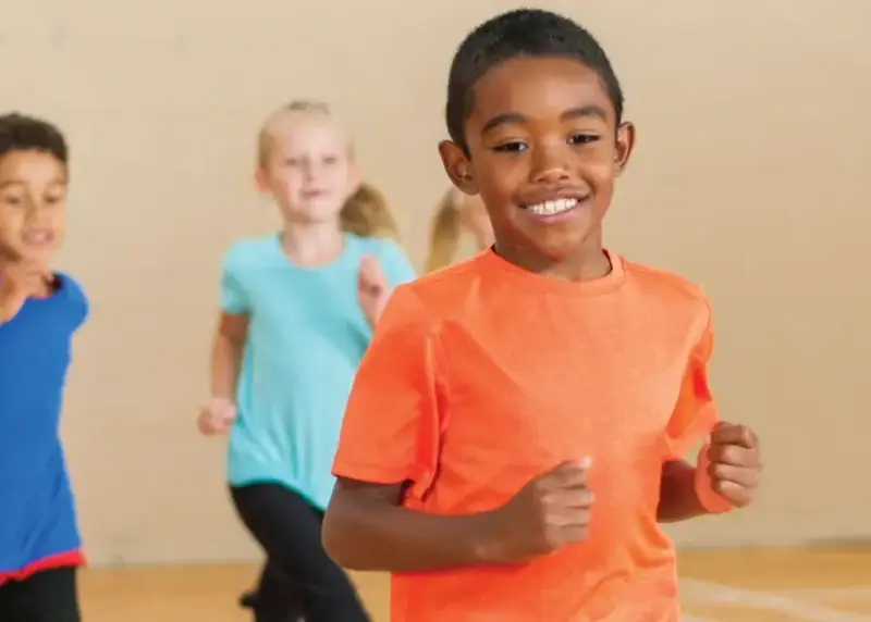 Children having fun in sports hall