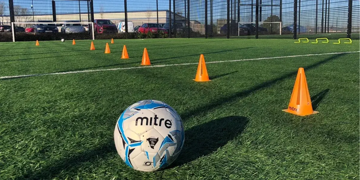 Football and cones on 3G pitch