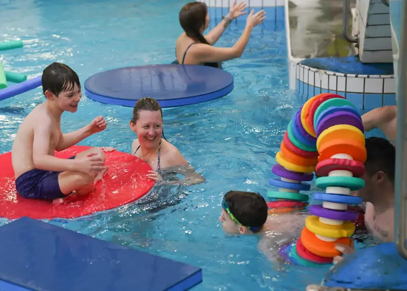 Group of people playing in a swimming pool