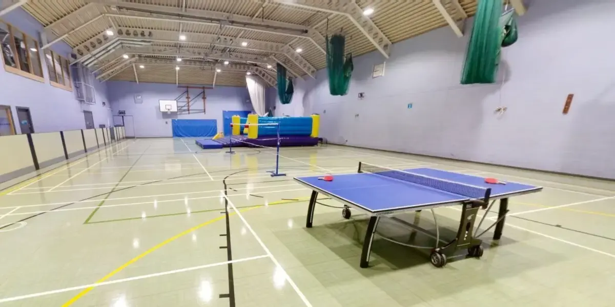 Sports hall with bouncy castle and table tennis